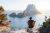 Man Sitting on Rock by Sea